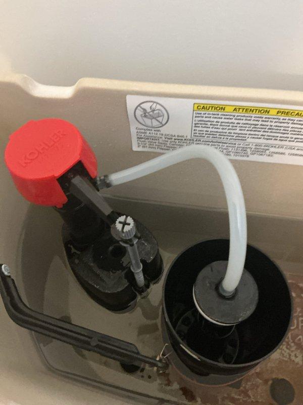Diagnosed and serviced KOHLER canister-style toilet with multiple issues including extended flush cycle, low water pressure, and slow draining sink. Inspection revealed mineral buildup on flush valve components and corroded drain assembly. Cleaned and replaced necessary components to restore proper water flow and drainage function.