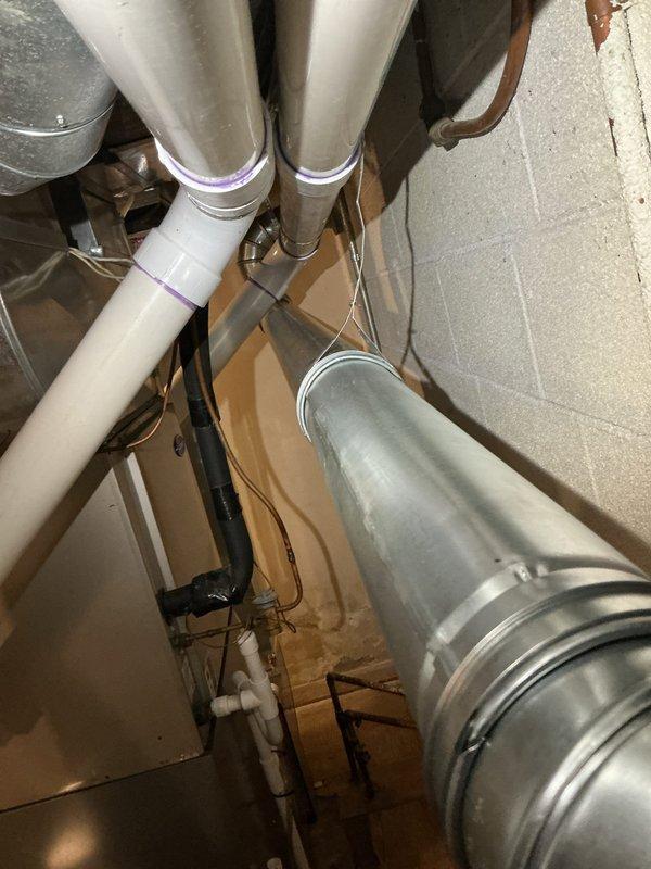 Successfully installed a new 50-gallon short water heater in basement utility area. Completed all necessary plumbing connections with properly primed PVC piping and ensured proper venting through existing metal ductwork. System was tested and confirmed operational with all connections secure.
