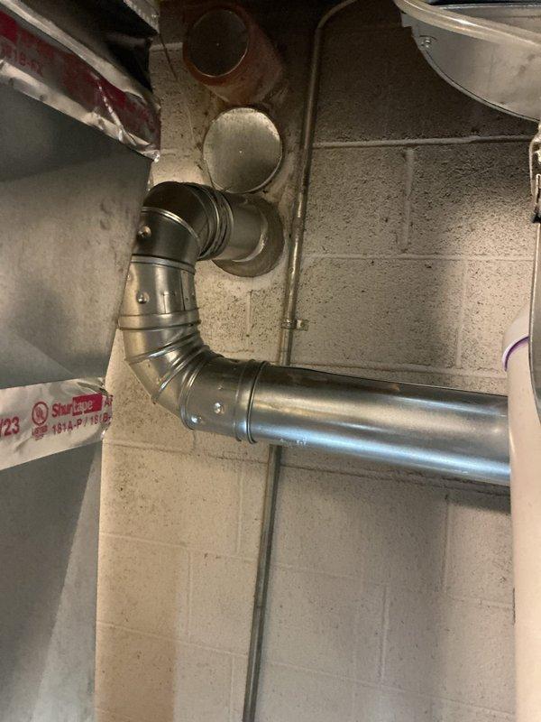 Successfully installed a new 50-gallon short water heater in basement utility area. Completed all necessary plumbing connections with properly primed PVC piping and ensured proper venting through existing metal ductwork. System was tested and confirmed operational with all connections secure.