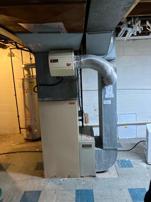 Conducted replacement estimate for 39-year-old furnace with failed ignition control module and heat exchanger. Visual inspection confirmed significant aging of existing HVAC system with visible corrosion on copper lines and dust accumulation throughout. Customer considering replacement options for furnace with potential addition of humidifier and AC components.
