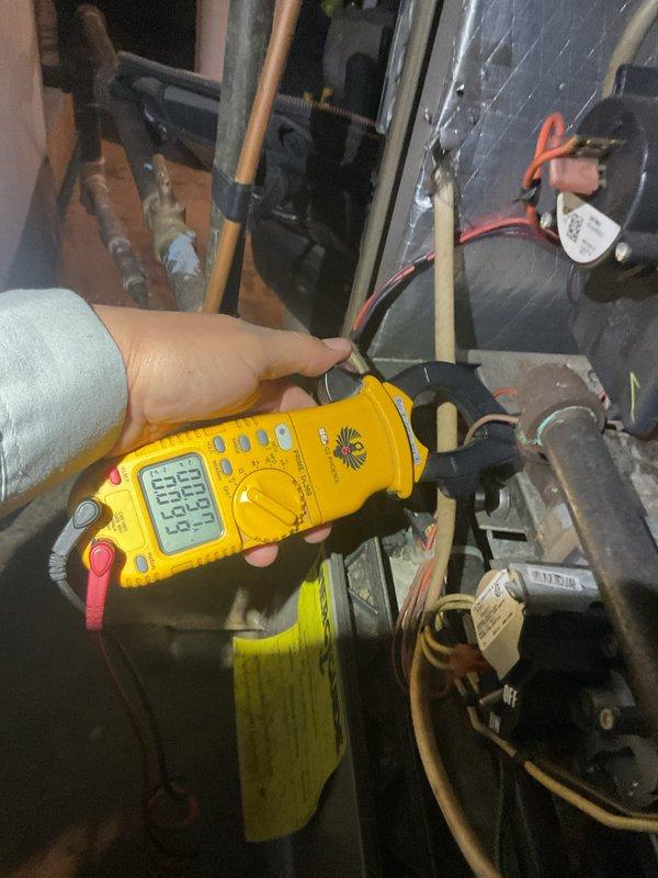 Performed routine maintenance on 14-year-old furnace system located in basement. Inspected and tested Lochinvar water heater, confirming proper operation with multimeter readings at 53.62. Completed comprehensive tune-up including evaluation of humidifier, thermostat, and hot water tank - all components functioning normally.