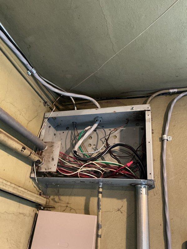 Conducted a site assessment for a potential Unico AC system installation in a historical home, inspecting the existing electrical infrastructure including the main breaker panel and junction box. Photos documented the current electrical setup, revealing aged wiring and potential upgrade requirements to support the high-velocity HVAC system requested by the homeowner.