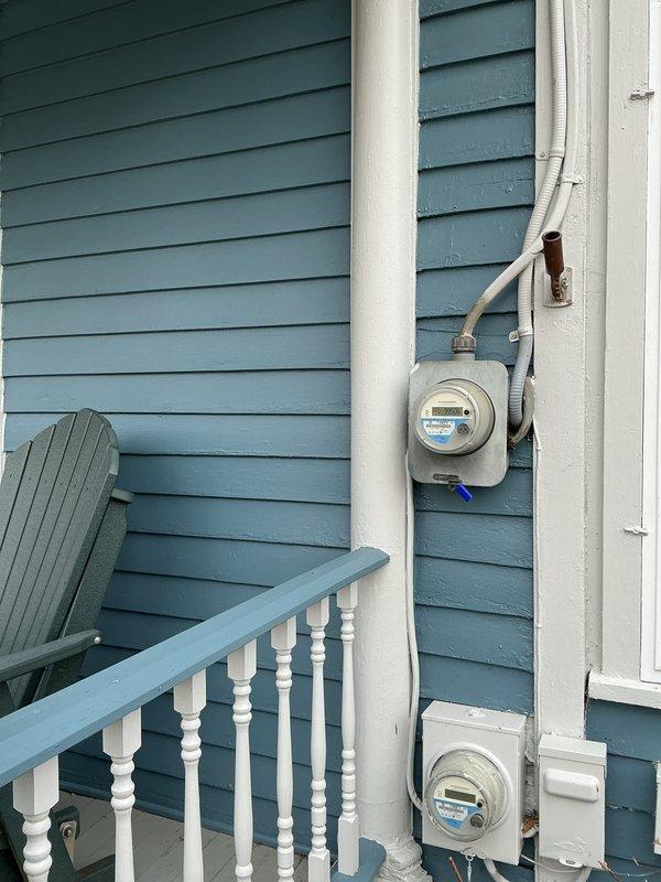 Conducted on-site evaluation for new generator installation at residential property. Assessed existing 200A electrical panel to determine generator integration requirements. Documented utility meter configuration on exterior blue siding for proper placement of transfer switch and service connection. Customer is interested in promotional generator package as advertised online.