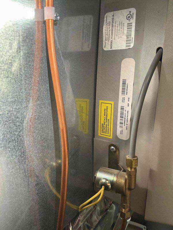 Responded to callback regarding non-functional humidifier. Inspected system and found water supply to humidifier was disconnected. Reconnected water line, verified proper water flow through unit, and tested humidifier operation. System now functioning correctly.