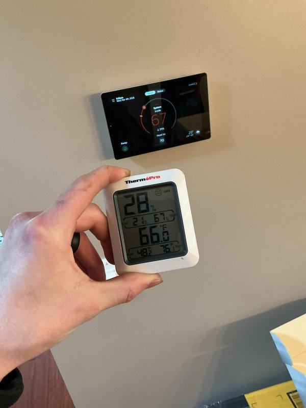 Responded to callback regarding thermostat temperature reading discrepancy. Verified customer complaint that S40 thermostat was reading 5-8 degrees lower than actual room temperature using multiple temperature probes for validation. Adjusted thermostat calibration to maximum setting to better align with actual room temperatures. Discussed potential replacement of thermostat as calibration adjustments may not fully resolve the issue long-term.