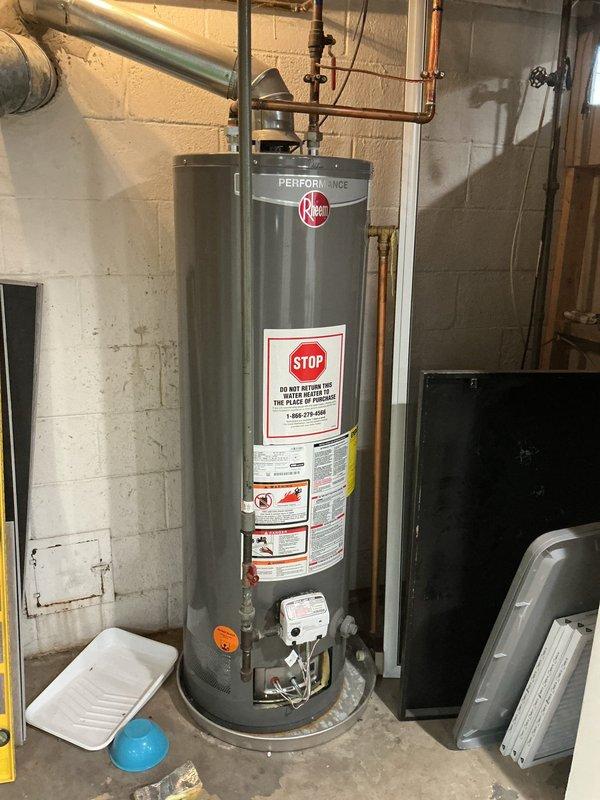 Responded to service call for inoperative tanked water heater. Diagnosed extinguished pilot light on Rheem Performance unit. Successfully relit pilot light, verified proper operation of water heater, and confirmed all connections were secure with no gas leaks present.