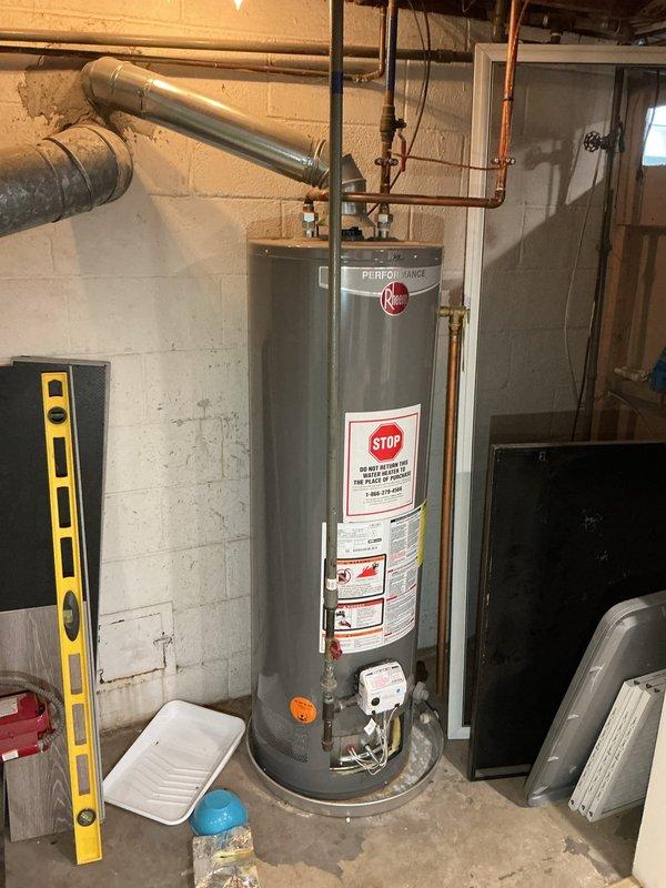Responded to service call for inoperative tanked water heater. Diagnosed extinguished pilot light on Rheem Performance unit. Successfully relit pilot light, verified proper operation of water heater, and confirmed all connections were secure with no gas leaks present.