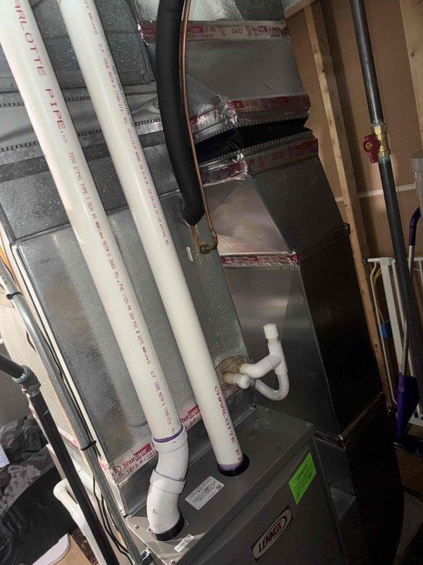 Responded to warranty service call for a newly installed Lennox furnace with reported leak. Upon inspection, identified leak in the condensate drain assembly at the P-trap connection. Replaced defective P-trap fitting and verified proper drainage function. All repairs completed under manufacturer warranty with no issues during final testing.