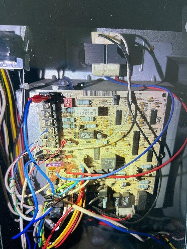 Diagnosed 17-year-old furnace with no heat issue despite unit powering on. Inspection revealed faulty control board with visible circuit damage and improper flame sensor operation. Replaced control board and verified proper ignition sequence and heat output, restoring normal system operation.