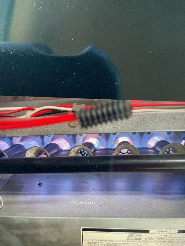 Diagnosed 17-year-old furnace with no heat issue despite unit powering on. Inspection revealed faulty control board with visible circuit damage and improper flame sensor operation. Replaced control board and verified proper ignition sequence and heat output, restoring normal system operation.