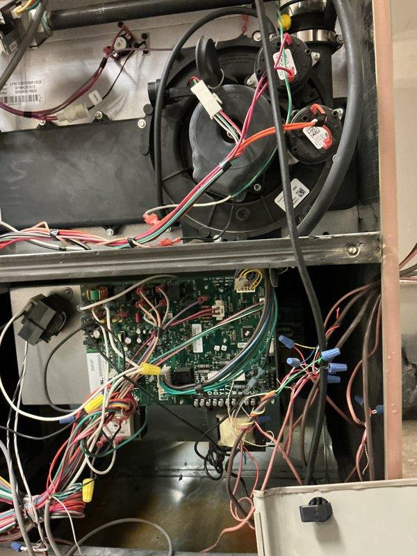 Performed scheduled inspection on three commercial furnaces (age 10+ years). Accessed control compartments to inspect blower motors, circuit boards, and wiring connections. All units operating properly with no issues identified; connections and components appear intact with proper wire routing. Documented system condition with photos for service records.