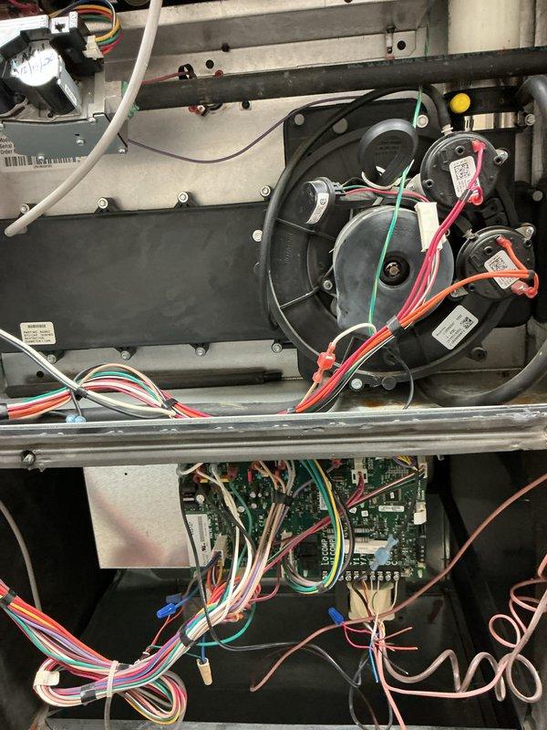 Performed scheduled inspection on three commercial furnaces (age 10+ years). Accessed control compartments to inspect blower motors, circuit boards, and wiring connections. All units operating properly with no issues identified; connections and components appear intact with proper wire routing. Documented system condition with photos for service records.