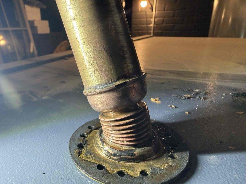 Performed diagnostic assessment on steam boiler system with focus on malfunctioning low water cut off (LWCO) that was failing to reset and causing feeder lockout. Inspection revealed severe corrosion and mineral buildup at pipe connections, particularly at threaded fittings and flange assembly. Ordered replacement LWCO component (PO: 1291848-001) and scheduled follow-up appointment to complete boiler skimming procedure to address mineral accumulation contributing to system failure.