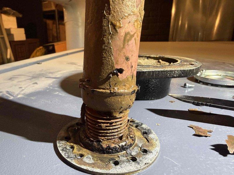 Performed diagnostic assessment on steam boiler system with focus on malfunctioning low water cut off (LWCO) that was failing to reset and causing feeder lockout. Inspection revealed severe corrosion and mineral buildup at pipe connections, particularly at threaded fittings and flange assembly. Ordered replacement LWCO component (PO: 1291848-001) and scheduled follow-up appointment to complete boiler skimming procedure to address mineral accumulation contributing to system failure.