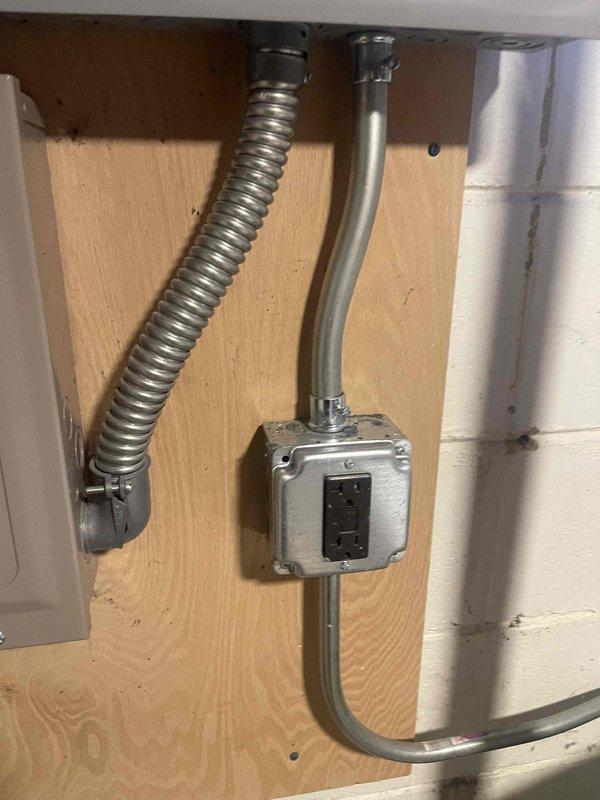 Successfully completed a 100 AMP panel upgrade with proper permit documentation. Installed A/C disconnect on brick exterior wall with appropriate conduit connections and mounted a GFCI outlet with metallic flex conduit in preparation for upcoming furnace and A/C installation.