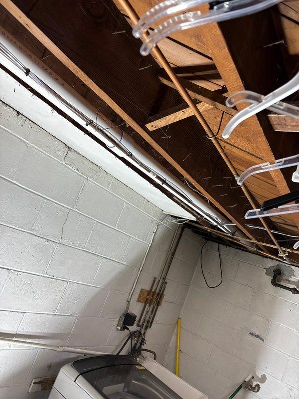 Successfully installed complete HVAC system including a 90,000 BTU furnace, 3.5-ton air conditioning unit, Carrier humidifier, and Sensi thermostat with appropriate connections to existing ductwork. System installation included proper venting with PVC pipes, electrical connections, and condensate pump setup, meeting all mechanical and electrical code requirements for residential application.