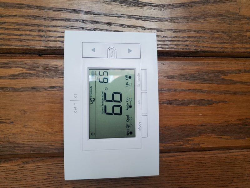 Conducted Gold Furnace Inspection on a 2025 Trane furnace located in the basement. Verified proper operation of the Sensi thermostat and inspected the furnace and water heater installation. System is functioning correctly with no immediate issues identified, though noted some water staining on ceiling panels near the HVAC equipment that should be monitored.