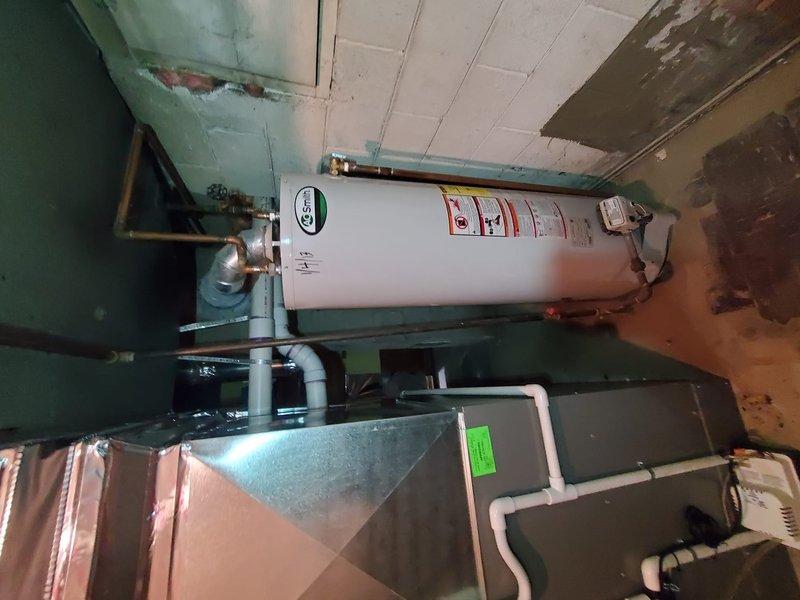 Conducted Gold Furnace Inspection on a 2025 Trane furnace located in the basement. Verified proper operation of the Sensi thermostat and inspected the furnace and water heater installation. System is functioning correctly with no immediate issues identified, though noted some water staining on ceiling panels near the HVAC equipment that should be monitored.