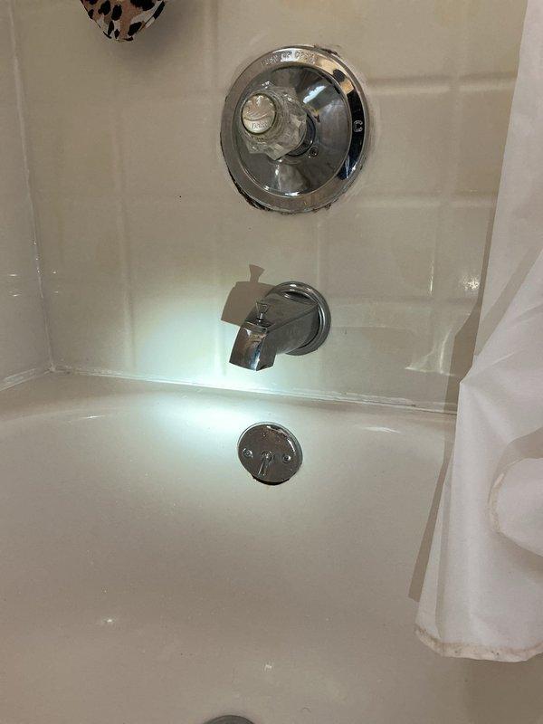 Responded to warranty service call for leaking hot water tank less than 1 year old in basement furnace room. Inspected unit, identified source of leak, and completed necessary repairs under existing manufacturer warranty. Documented repair with photos of the affected area for warranty claim processing.