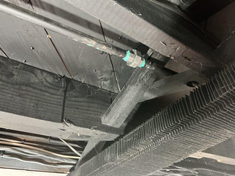 Responded to gas leak report and completed diagnostic inspection of utility area plumbing system. Located and repaired gas line connection failure at the ceiling junction point by replacing deteriorated seals and applying appropriate thread sealant to metal fitting connections. Performed pressure testing after repair to verify system integrity and ensure complete elimination of gas leakage.