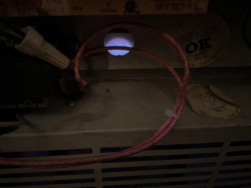 Performed Gold Furnace Inspection on a 20-year-old furnace and boiler system located in the basement. Verified proper operation of the burner assembly with visual confirmation of clean blue flame combustion across all five burners. System indicator light functioning normally, with no immediate operational concerns identified.