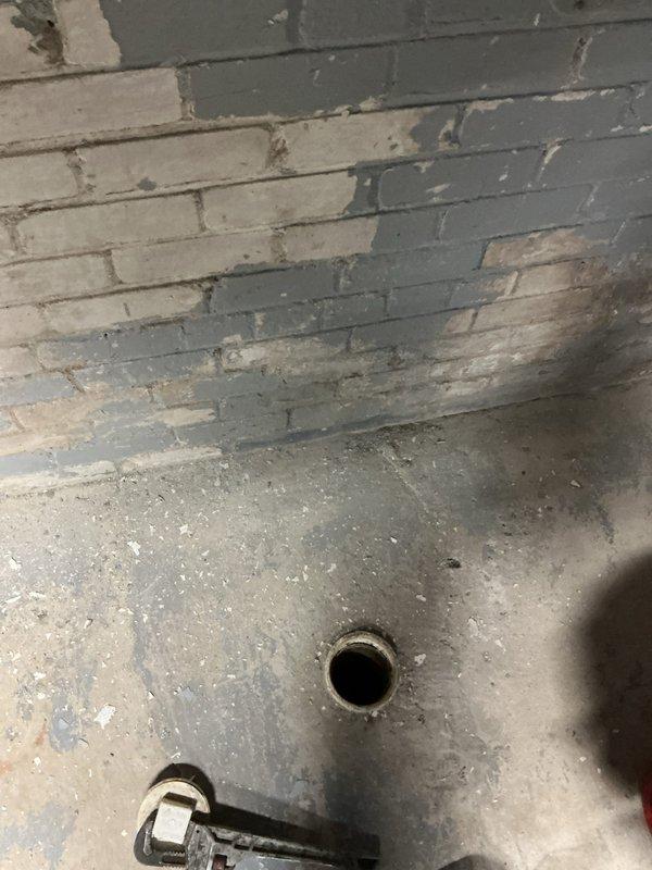 Responded to a basement toilet backup and discovered significant corrosion on copper supply lines with active leaks. Upon inspection, found deteriorating wall panels near the plumbing installation with visible water damage to surrounding wooden floor. Cleared drain blockage, replaced corroded copper pipes, installed new shut-off valves, and applied snake bites to repair leaking sections in both toilet and shower plumbing systems.