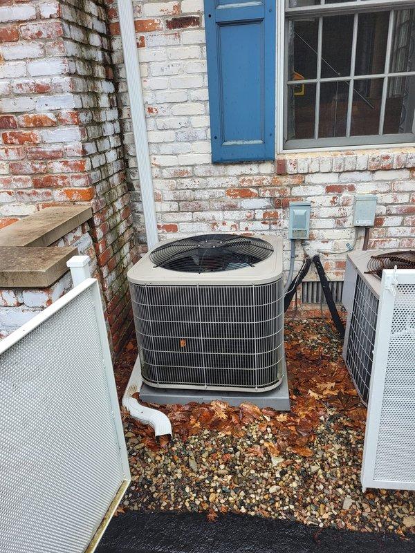 Conducted diagnostic assessment on 10+ year old furnace not heating properly, located upstairs. Inspection of existing outdoor HVAC system revealed two aging condensing units installed against brick exterior wall showing significant weathering. Recommended complete system replacement due to heat exchanger failure and overall equipment age.