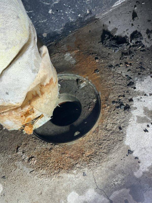 Responded to commercial sewer line service request regarding persistent odor. Inspected floor drain which showed signs of deterioration around the opening with visible staining and debris accumulation. Identified need for drain cleaning and potential sealing of concrete surrounding the fixture to prevent further seepage and eliminate odor source.