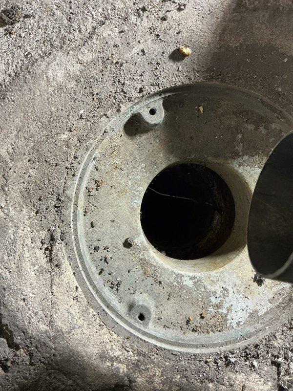 Responded to commercial sewer line service request regarding persistent odor. Inspected floor drain which showed signs of deterioration around the opening with visible staining and debris accumulation. Identified need for drain cleaning and potential sealing of concrete surrounding the fixture to prevent further seepage and eliminate odor source.