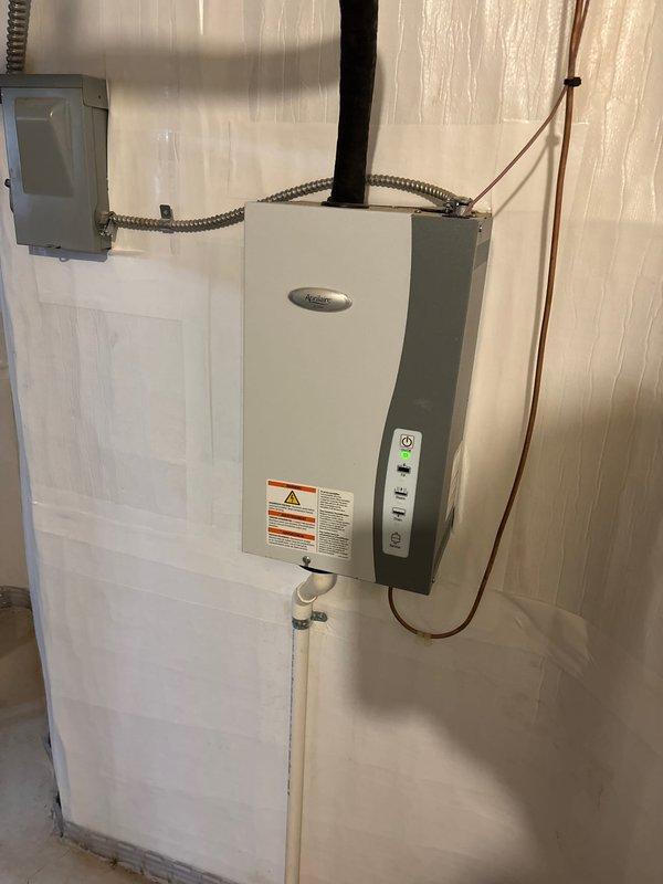 Completed installation of complete HVAC system including 135,000 BTU furnace and 5-ton AC unit with S40 control system. Installation included proper venting with PVC exhaust pipes, copper line connections, and electrical hookup requiring professional reconnection. System was successfully tested and is operating at optimal performance.