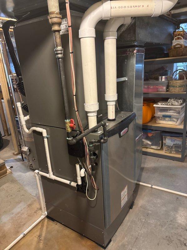 Completed installation of complete HVAC system including 135,000 BTU furnace and 5-ton AC unit with S40 control system. Installation included proper venting with PVC exhaust pipes, copper line connections, and electrical hookup requiring professional reconnection. System was successfully tested and is operating at optimal performance.