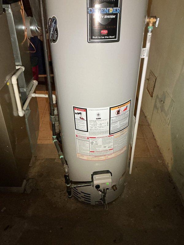 Diagnosed Bradford White water heater with pilot light issue affecting hot water supply. Inspected gas control valve and ignition assembly, discovering pilot light had extinguished. Cleaned thermocouple, relit pilot light, and verified proper operation with stable flame. Hot water now functioning at appropriate temperature.