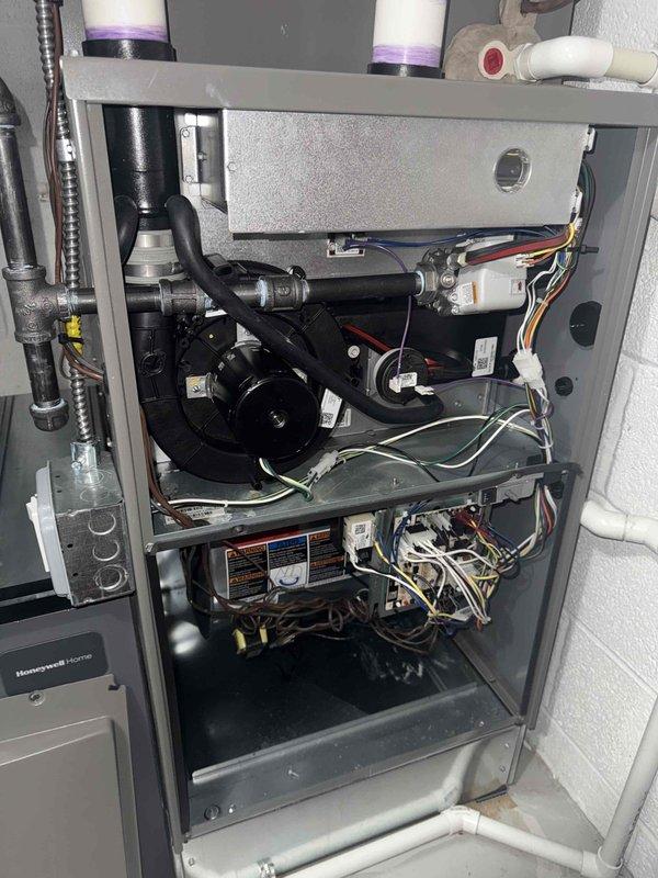 Responded to service call for Honeywell Home furnace (installed 2023) with reported blinking red light. Upon inspection, removed front panel to access internal components and examined blower motor, control board, and electrical connections. Confirmed system was operating normally and blinking light was standard operational indicator, not a fault code. No repairs needed as all components were functioning properly.