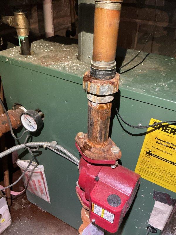 Replaced faulty 30psi pressure relief valve and installed new pressure reducing valve eliminator on severely corroded copper pipe system connected to boiler unit, addressing active water leak and preventing potential system failure.