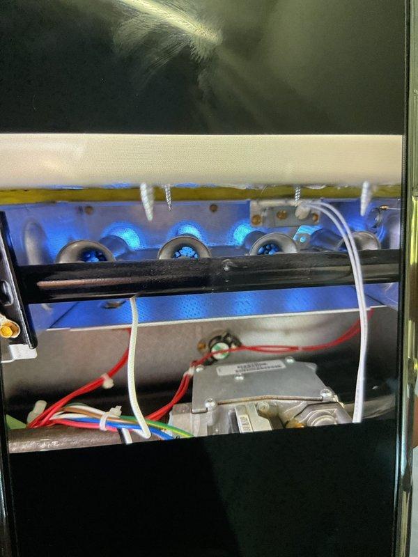 Completed Gold Furnace Inspection on three units (garage, upstairs, and basement) from 2017. Inspected flame pattern and gas valve operation, which appeared normal, though noted previous water leakage on 2nd floor unit that has since resolved. Temperature readings were taken with probe to verify proper operation across all systems.