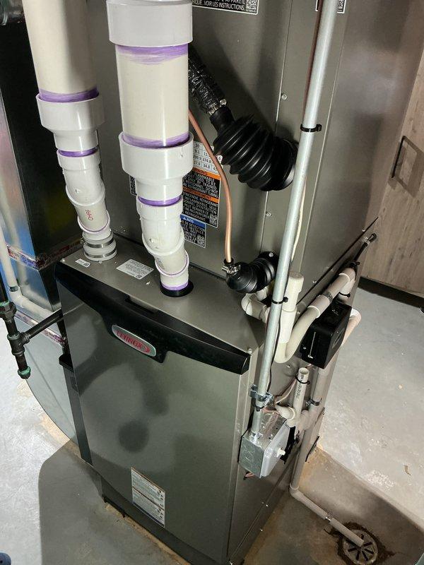 Successfully installed a complete HVAC system including a 110,000 BTU furnace, 4-ton air conditioning unit, and humidifier with proper ventilation. System includes S40 thermostat, 600M filter media, and APCO UV air purification system, with all components properly connected and tested. Completed installation qualifies for utility rebates and AHRI certification (#216722604).