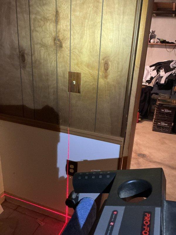 Addressed City of Troy electrical and mechanical violations by adjusting the switch position between ductwork for proper accessibility and installed approved combustion air supply to the mechanical room. Verified compliance using laser level measurements and documented the wooden panel wall conditions with ventilation components before and after corrections.