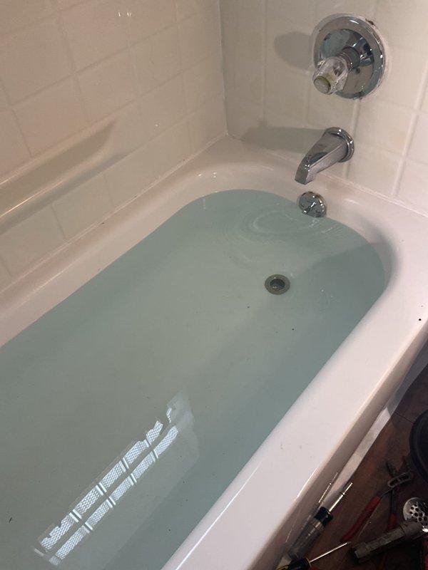 Replaced waste and overflow assembly on bathtub, including installation of new PVC drain pipe with P-trap and connection to existing plumbing. Verified proper drainage and leak-free operation by conducting a water test with the tub partially filled.