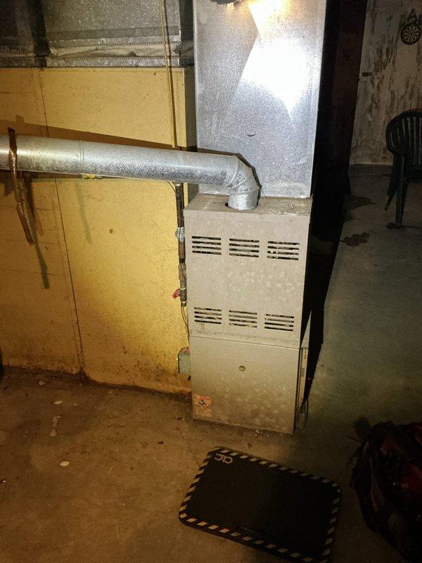 Responded to no-heat call for 10+ year old furnace located in basement. Upon inspection, found significant dust accumulation and signs of age-related wear. Performed thorough cleaning of unit, replaced air filter, and tested system operation. Unit now functioning properly with restored airflow and heating capacity.