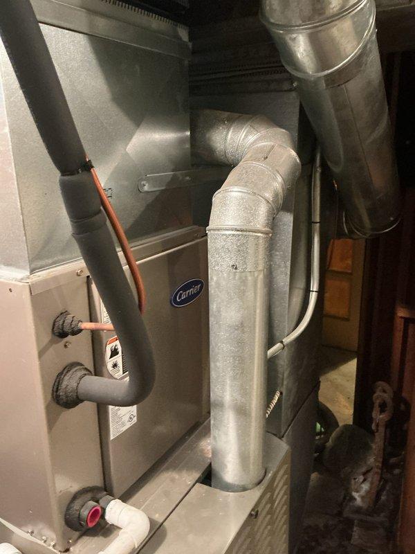 Responded to service call for 19-year-old Carrier furnace located in basement. Performed diagnostic inspection of heating system with focus on chimney liner, humidifier wire tubing, and venting connections. Identified oxidation at copper pipe joints and evaluated condition of ductwork and condensate drainage system. Provided customer with requested quote for chimney liner replacement, humidifier wire tubing repair, and vent pipe modifications.