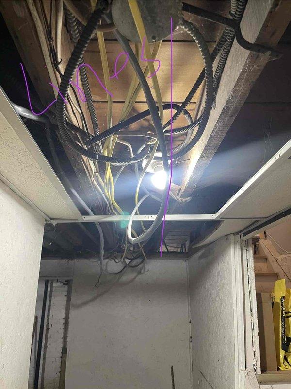 Conducted comprehensive assessment for HVAC replacement quote (CQ 07506-01) involving non-operational AC unit with natural gas furnace. Documented current installation conditions including existing air handler/furnace with cylindrical duct connections and flexible metal conduit. Photographed exposed electrical infrastructure with multiple conduits and wiring to facilitate proper system design and installation planning.