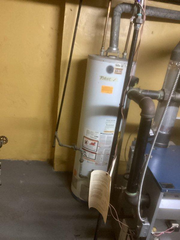 Completed Gold Boiler Inspection on 7-year-old steam boiler located in basement. Documented water damage around ceiling pipe penetration and identified potential leak issue. Equipment appears operational but recommend addressing water damage to prevent further deterioration of surrounding structural materials.