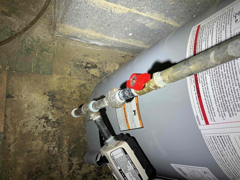 Conducted a Gold Furnace Inspection in the basement at customer's request. Upon arrival, observed that the unit in question was actually a Reliance water heater rather than a furnace. Documented the condition of the water heater, including connections, pressure relief valve, and surrounding installation area for future reference.