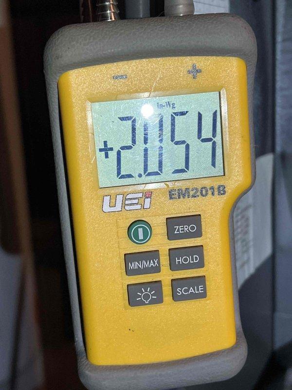 Performed furnace inspection on 12-year-old unit that was not producing heat. Diagnostic testing revealed low gas pressure readings (2.054 InWg) and measured voltage outputs of 0.32V/0.24V at control board. Adjusted gas pressure to manufacturer specifications and restored proper voltage to ignition circuit, successfully returning system to normal heating operation.
