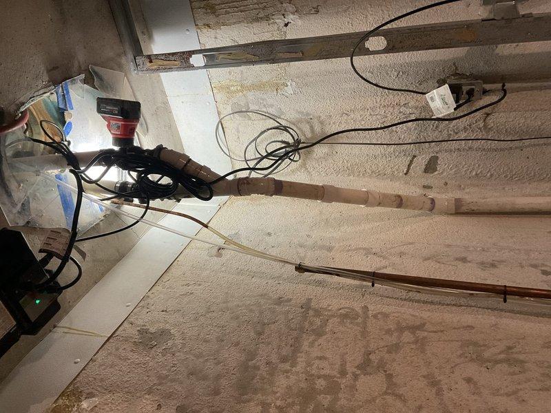 Inspected sump pump system in basement and found battery backup unit with significant corrosion on terminals. Replaced deteriorated battery and cleaned corroded connections to restore emergency backup functionality. System now operational with both primary and secondary power sources functioning properly.