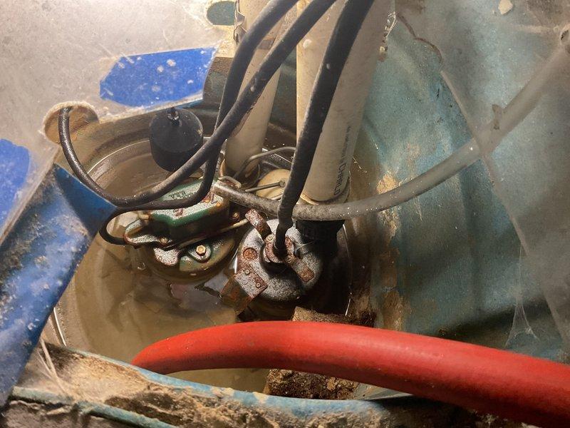 Inspected sump pump system in basement and found battery backup unit with significant corrosion on terminals. Replaced deteriorated battery and cleaned corroded connections to restore emergency backup functionality. System now operational with both primary and secondary power sources functioning properly.