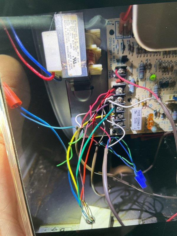 Installed additional control wire to HVAC system per approved estimate, connecting from circuit board terminal block to gas valve assembly. Verified proper connection of all existing wiring (red, blue, green, yellow, white, orange, purple) to ensure system functionality after modification.