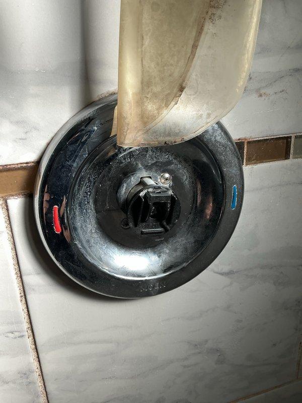 Diagnosed and repaired a leaking shower in a 1960s home by accessing the plumbing through the wall cavity to inspect the galvanized steel piping and valve assembly. Identified deterioration at the valve connection point as the source of the leak and replaced the affected components, restoring proper function to the first-floor shower fixture.