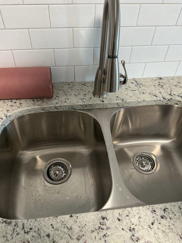 Responded to service call for commercial boiler system not providing warm air. Upon arrival, discovered plumbing issues in kitchen area instead of HVAC concern. Found significant discoloration and mineral buildup on sink drain pipes that require replacement. Note: Service call appears to have been incorrectly categorized as boiler maintenance.