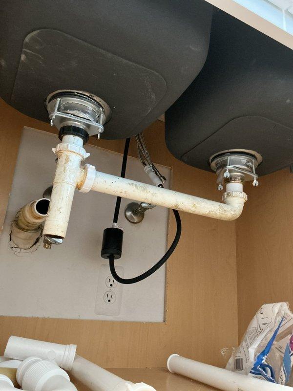 Responded to service call for commercial boiler system not providing warm air. Upon arrival, discovered plumbing issues in kitchen area instead of HVAC concern. Found significant discoloration and mineral buildup on sink drain pipes that require replacement. Note: Service call appears to have been incorrectly categorized as boiler maintenance.